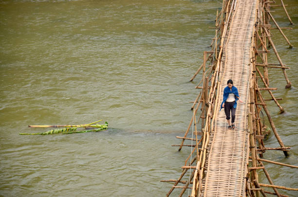Bamboo bridge design over the river in the park