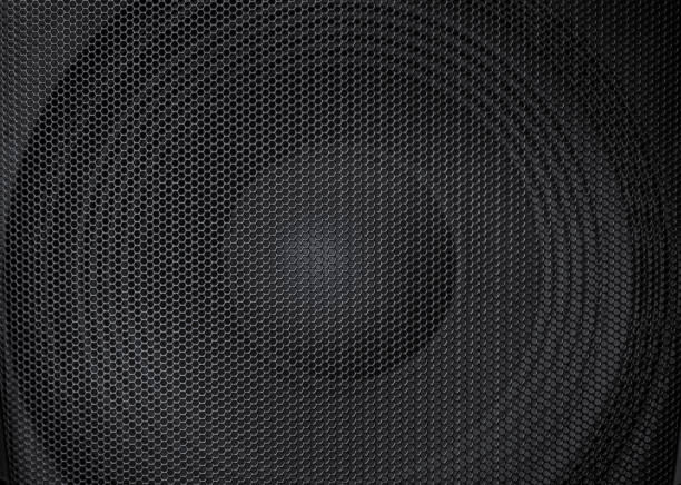 gorgeous abstract view of a big, large powerful speaker with detailed protective metal grille in front stock photo