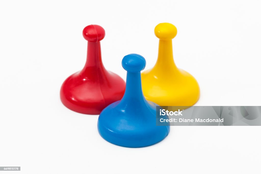 Three game tokens in primary colors Board Game Stock Photo