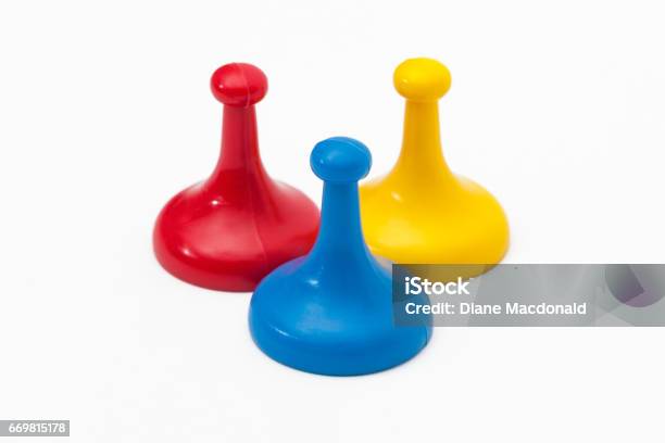 Three Game Tokens In Primary Colors Stock Photo - Download Image Now - Board Game, Part Of, Leisure Games