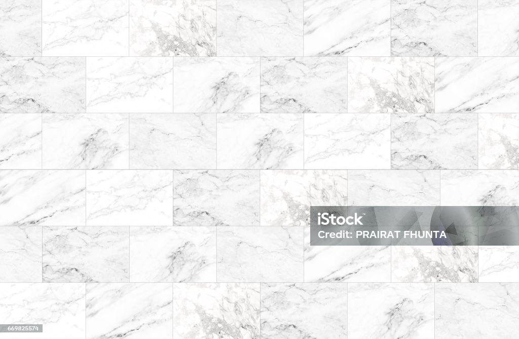 The luxury of white marble tiles texture and background. The luxury of white marble tiles texture and background, Can be used for creating abstract marble surface effect to your design art work. Marble - Rock Stock Photo