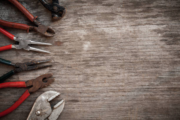 istock Group of grunge tools on wooden background with empty space for  text or brand. 669828758