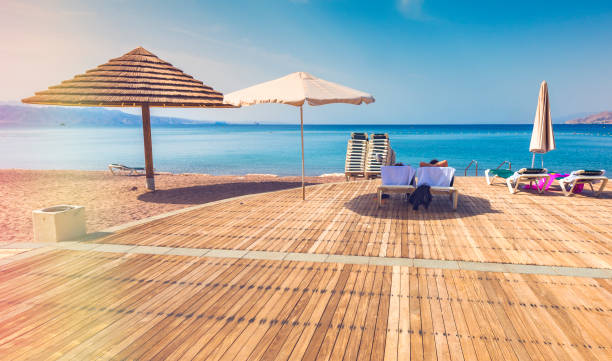 istock Wooden pleasure terrace on central public beach in Eilat 669829406