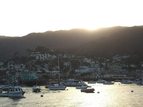Sunset falls upon the hills overlooking Avalon Harbor at Catalina Island...which is 20 miles off the coast of Los Angeles.