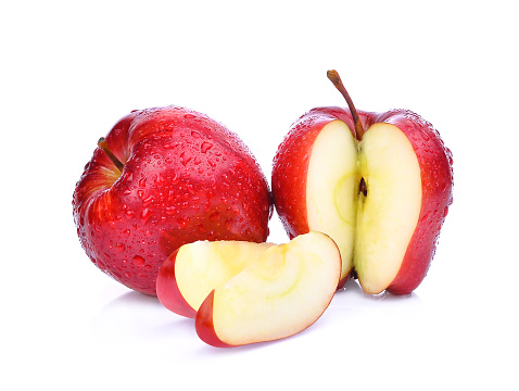 fresh red apples with water drops isolated on white background