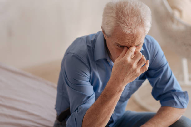 istock Depressed unhappy man holding his nasal bridge 669842262