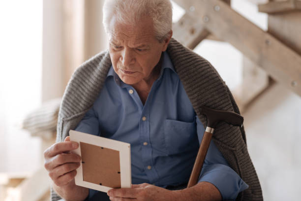 istock Depressed cheerless man remembering his wife 669843992