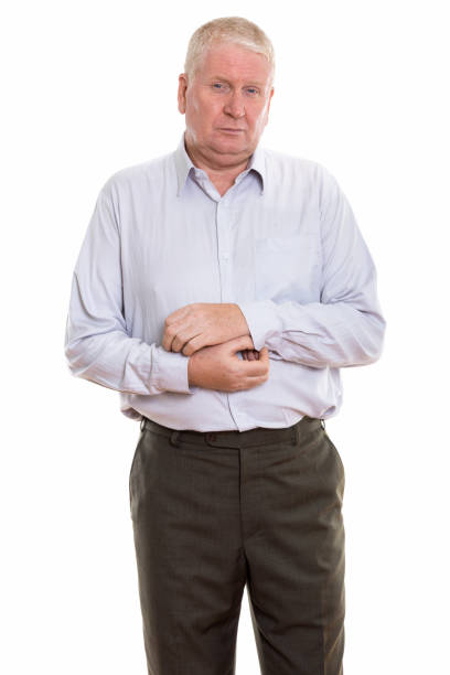 istock Studio shot of mature businessman standing while fixing sleeve 669850028
