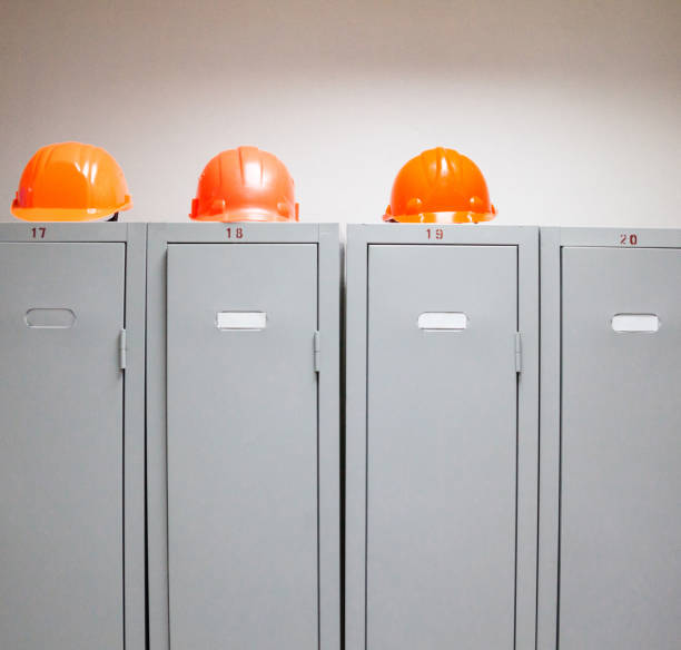 istock Metal lockers and plastic hard hats 669850168