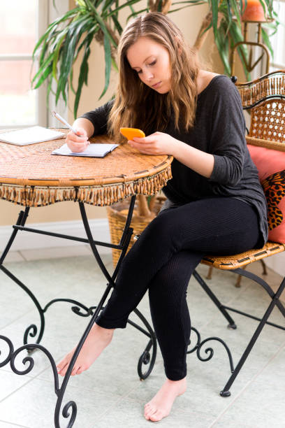 istock Teen learns to use checking account 669851502