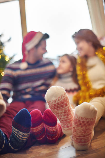 istock Close up of foot in warming wool socks 669857052