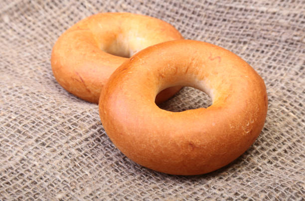 istock Fresh authentic New York style bagel isolated on Canvas cloth background 669861520