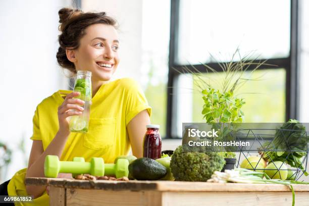 Woman With Healthy Food Indoors Stock Photo - Download Image Now - Drinking, Women, Healthy Eating