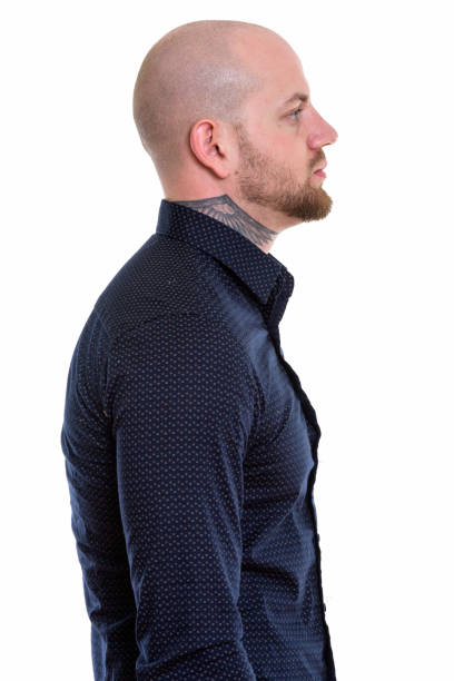 istock Profile view of young bald muscular businessman 669861882