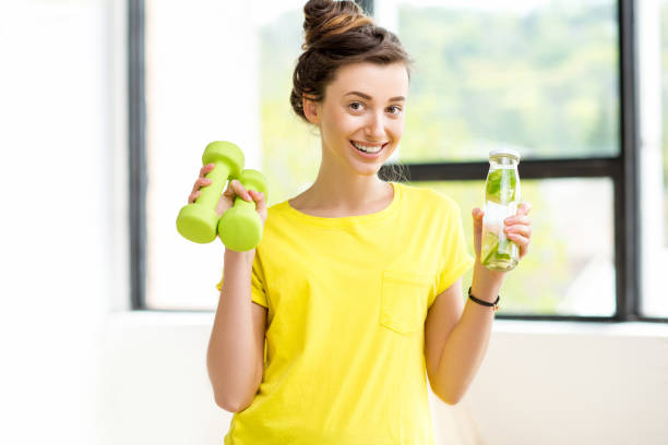 istock Woman exercising indoors 669861982