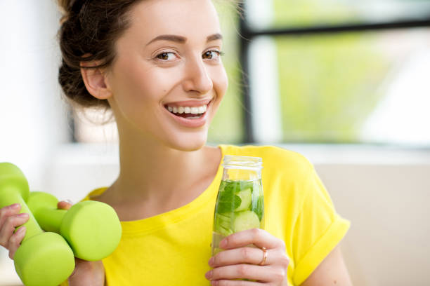 istock Sports woman drinking water 669862692