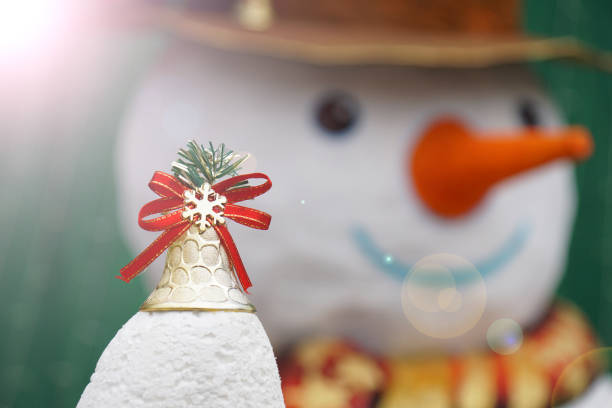 istock Christmas Golden Bell with snowman and flare effect 669862720