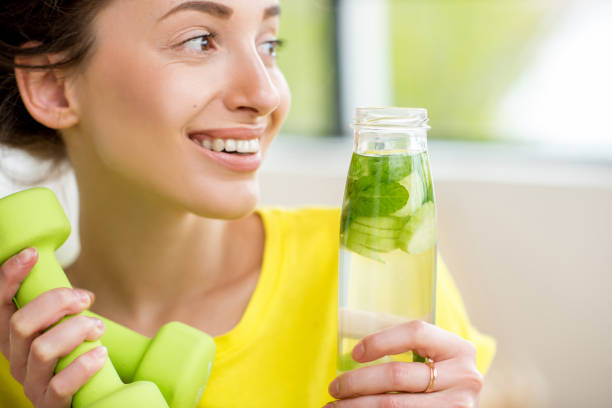 istock Sports woman drinking water 669862808