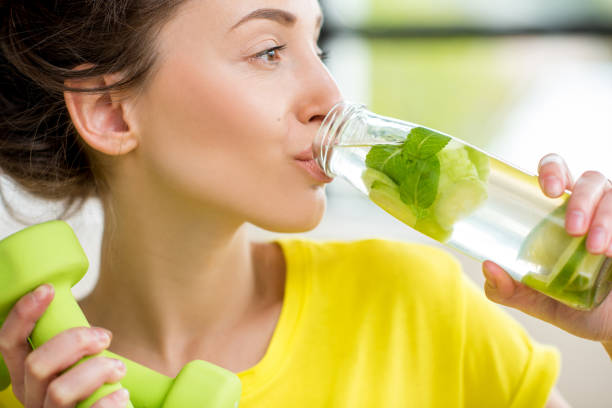 istock Sports woman drinking water 669862868