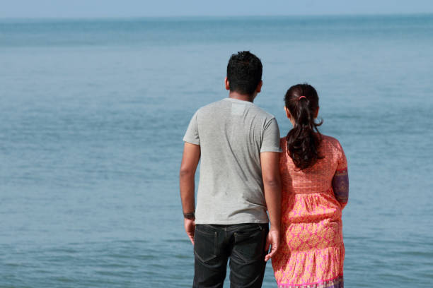 istock Romantic couple enjoying the sea 669863334