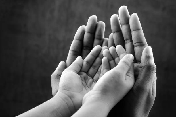 Hands of a kid on an elder's