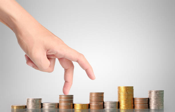 istock Hand human hand putting coin to money 669872432