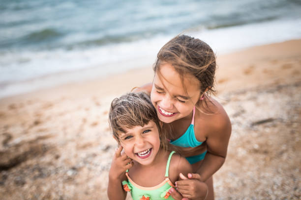 istock Children are fooled at sea shore 669873146
