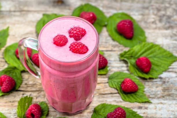 istock Yogurt smoothie with raspberries, fruit dessert, healthy dieting concept 669878644