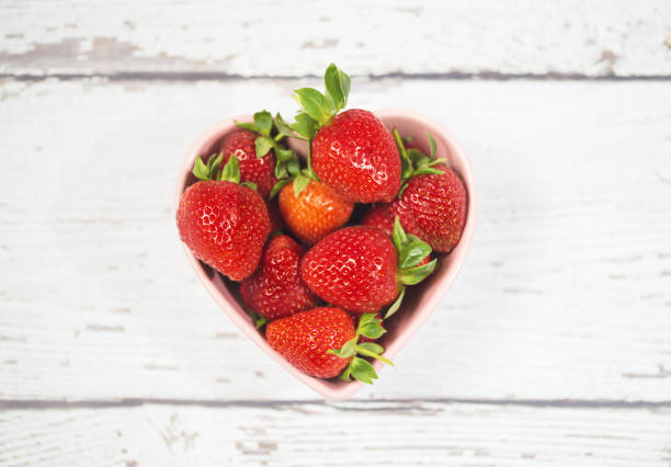 istock Fresh Strawberries on White Wooden Background 669881662
