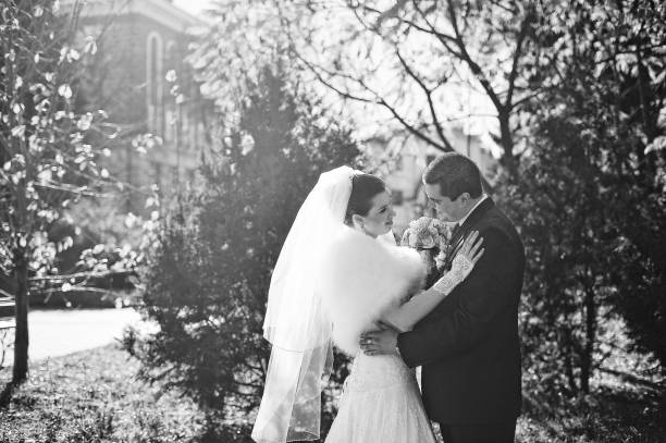 istock Gorgeous married couple embrace, black and white 669887484