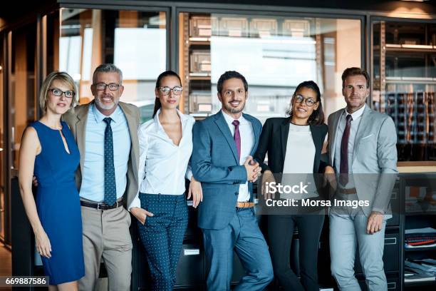 Business People Standing In Row At Textile Factory Stock Photo - Download Image Now - Teamwork, Business, Businessman