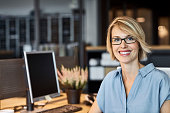 istock Confident businesswoman smiling in office 669887816