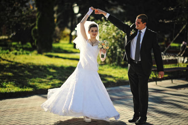 istock Dancing wedding couple outdoors 669887840