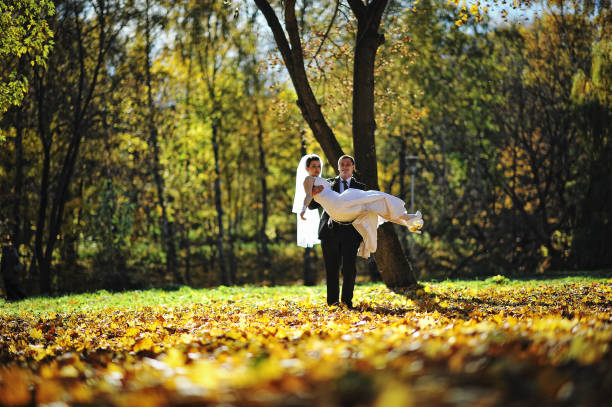 istock Glorious newlyweds at autumn sunshine 669887956