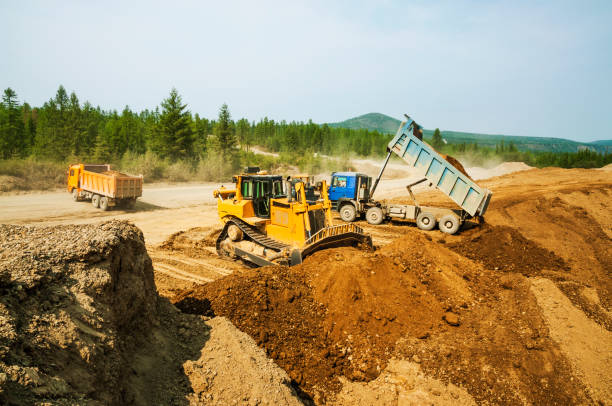 istock Tippers in operation, unloading of soil 669891262