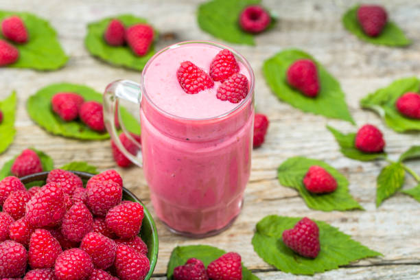 istock Fruit smoothie with yogurt and raspberries, healthy dessert concept 669892476