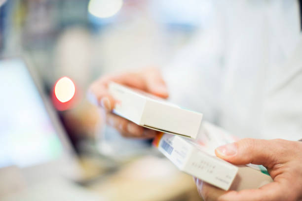 istock Cropped image of pharmacist holding medicines 669895608