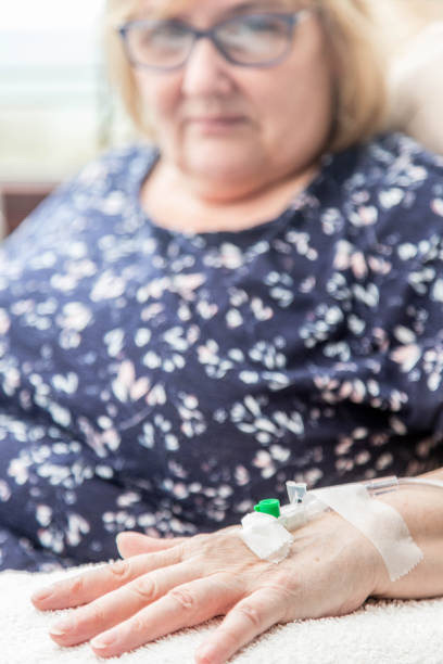 istock sick woman on intravenus drip 669896364