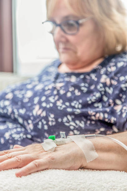 istock sick woman on intravenus drip 669896602