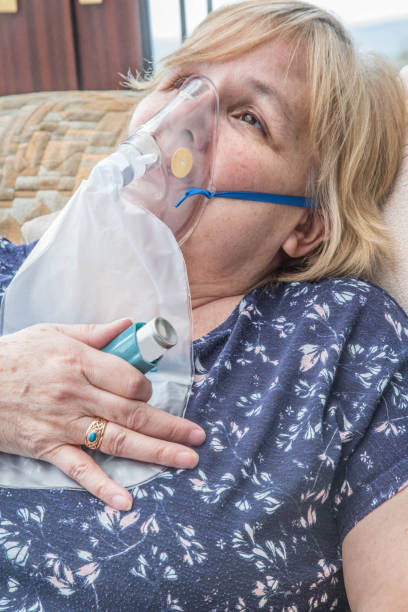 istock mature woman suffering asthma attack 669898830