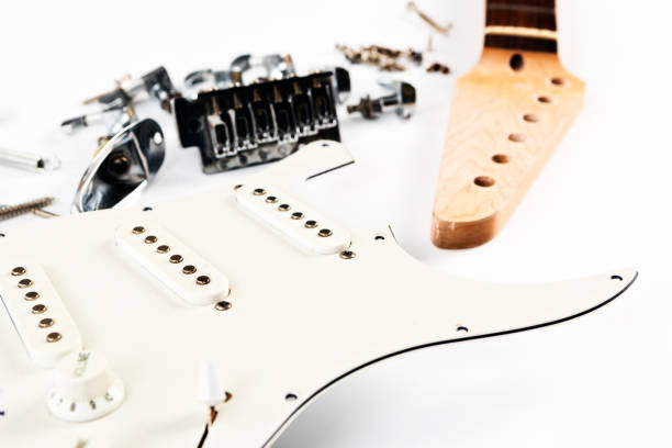 istock Dismantled electric guitar parts on white 669899912