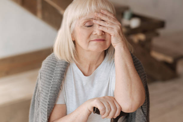 istock Sad elderly woman closing her eyes 669902182
