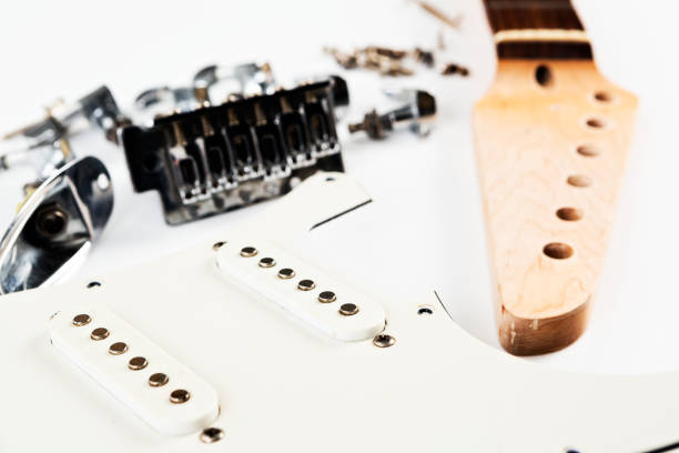 istock Dismantled electric guitar parts on white 669902270