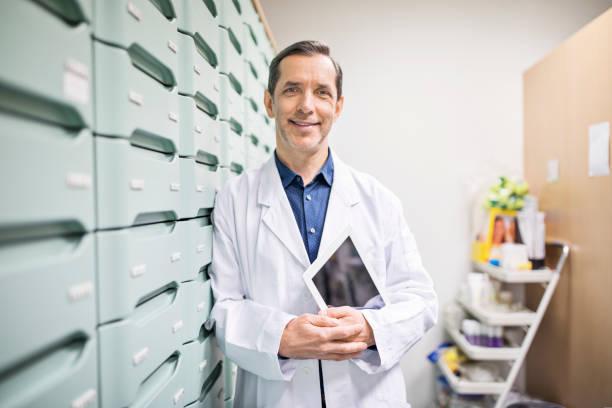 istock Pharmacist standing by drawers in storage room 669902466