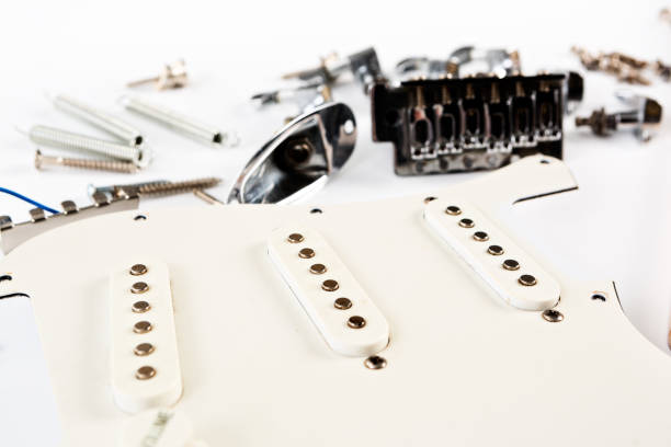 istock Dismantled electric guitar parts on white 669902580
