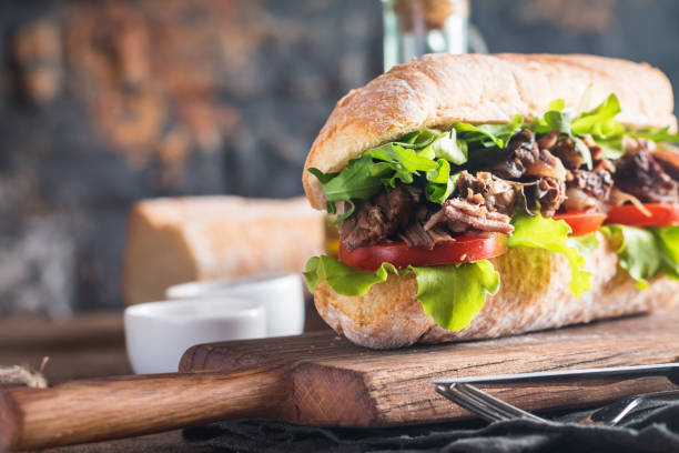 istock Beef sandwich with tomato and salad 669906408