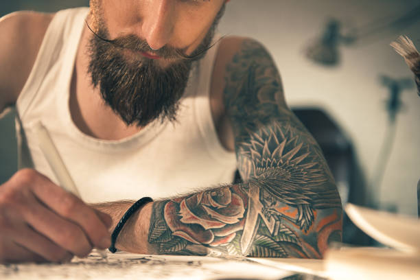 istock Male with image on arm drawing art 669906606