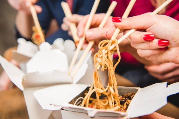 istock People eating noodles 669906718