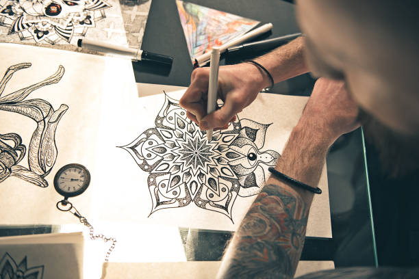 istock Man designing attractive picture at table 669906774