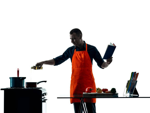 istock man cooking chef silhouette isolated 669907234